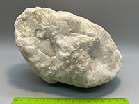 A white rock composed of large calcite crystals.